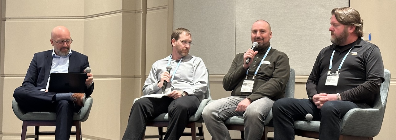 Tomáš speaking on a panel at ICMC 2025
